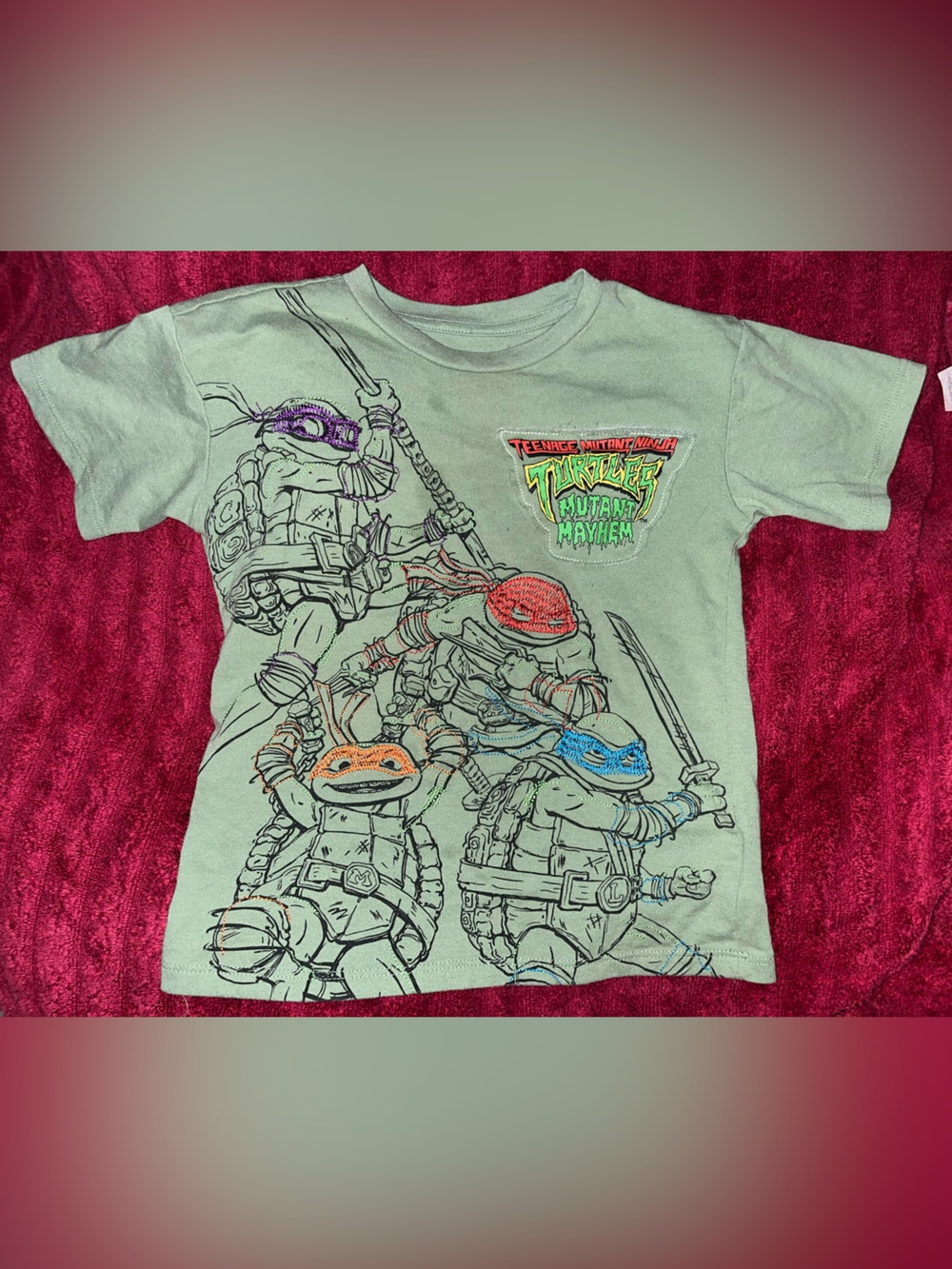 Green Teenage Mutant Ninja Turtles Graphic Tee with Colorful Masks